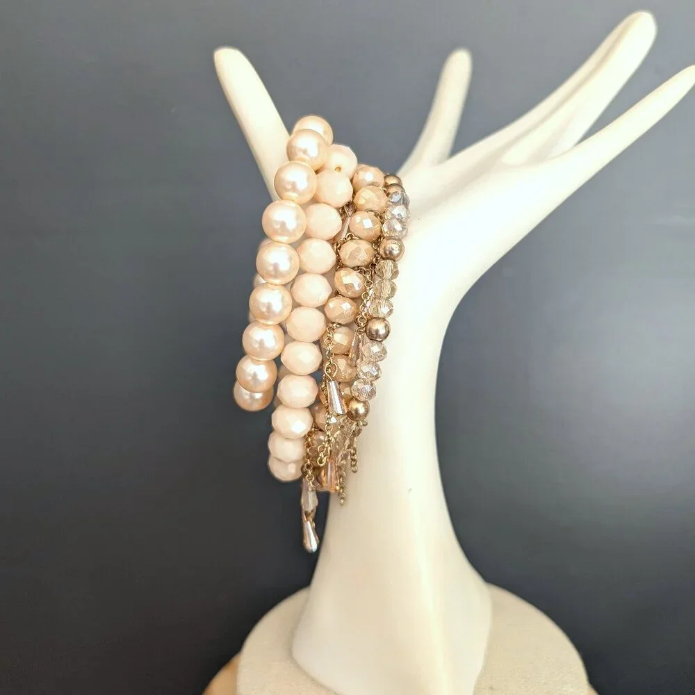 Bundle of nude and natural beaded stretch bracelets